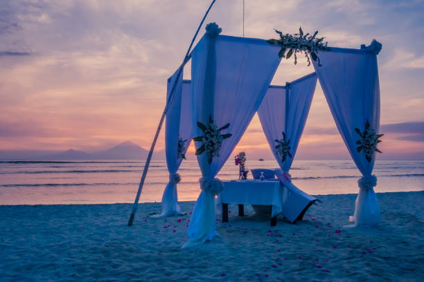 istock dinner table at the beach and in blue hour. 955556106