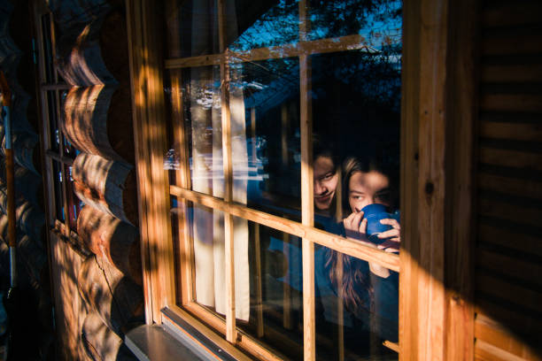 istock Young Couple Spending Time in Log Cabin Together 955556306