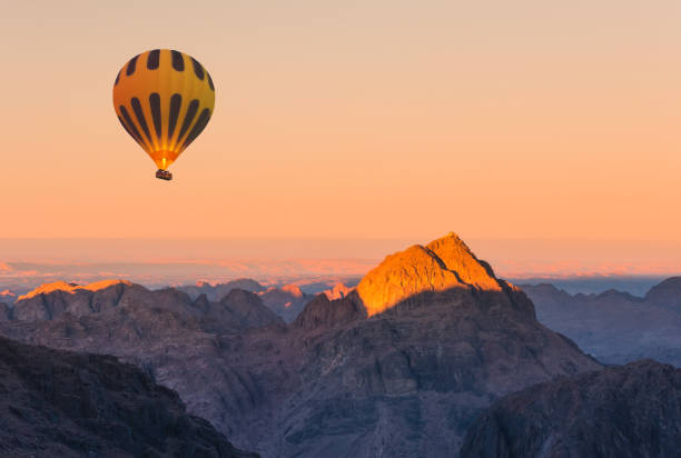 istock Hot air balloon over Mount Moses Sinai sunset 955559122
