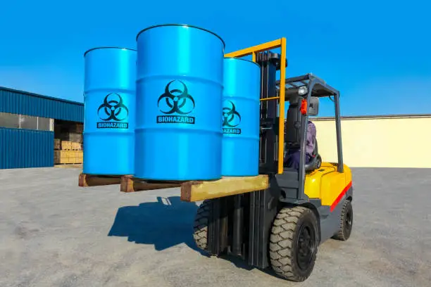 Photo of Blue barrels on forklift truck.