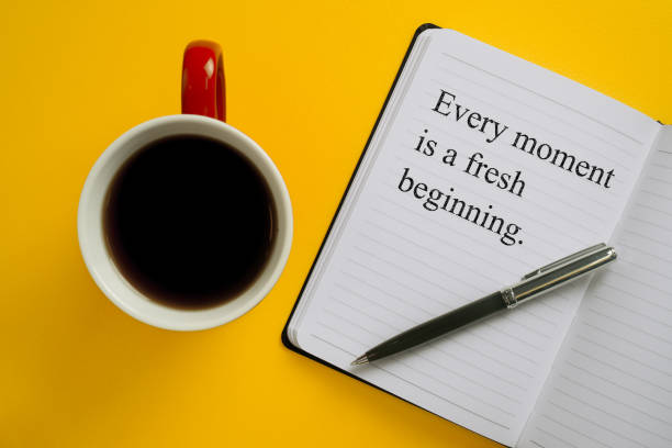 istock Notebook with inspirational quote with pen and coffee mug. Every Moment is a Fresh Beginning. 955569246