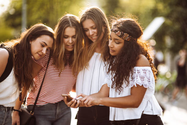 istock teens friends using the smartphone in the city 955569334