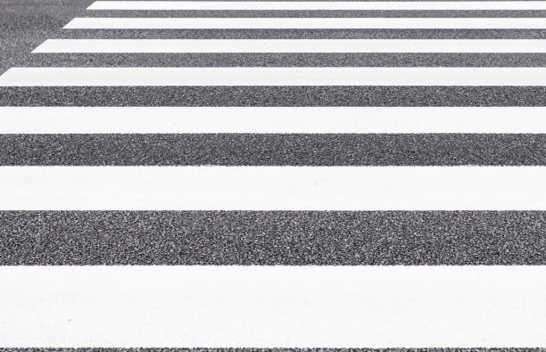 istock Close - up Zebra crossing pattern on city road 955576466