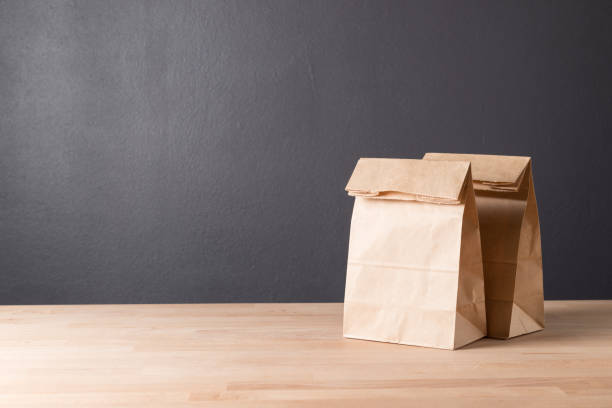istock simple brown paper bag for lunch or food on table 955579124