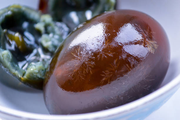 istock Close-up of Chinese Century Eggs in White Bowl 955579994