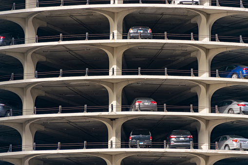 Chicago, IL, United States: April 22nd, 2018 - Shot of parked cars in the parking lot in lower levels of the Marina City Towere in Chicago, Illinois.