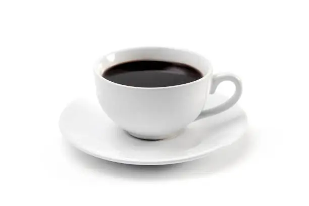 Photo of Cup of Strong Black Coffee in a White Cup and Saucer