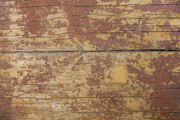 istock Wood background from old boards with peeling red paint 955603188