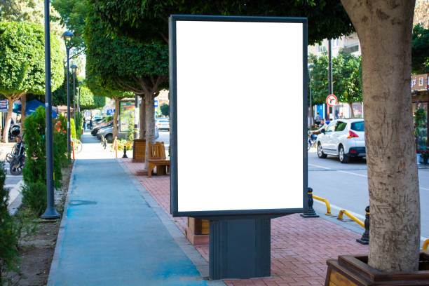 istock Blank vertical street billboard stand with city background. 955607484