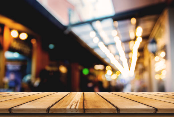 istock Empty wooden table space and front of abstract blurred background for product display montage. 955607918
