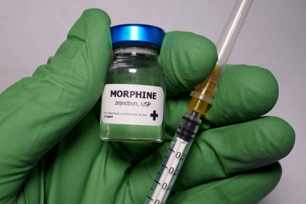 Morphine opioid pain medication Morphine - a substance that acts on opioid receptors and is primarily used for pain relief and anesthesia. morphine drug stock pictures, royalty-free photos & images