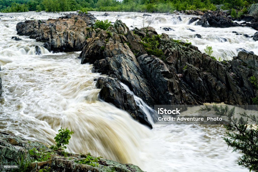 Raging Waters of the Potomac River Great Falls Virginia Raging Waters of the Potomac River Great Falls Virginia - Scenic canyon with water flowing through rugged rocks. Canyon Stock Photo