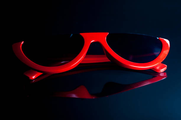 istock Red fashion sunglasses on a black background. 955614880