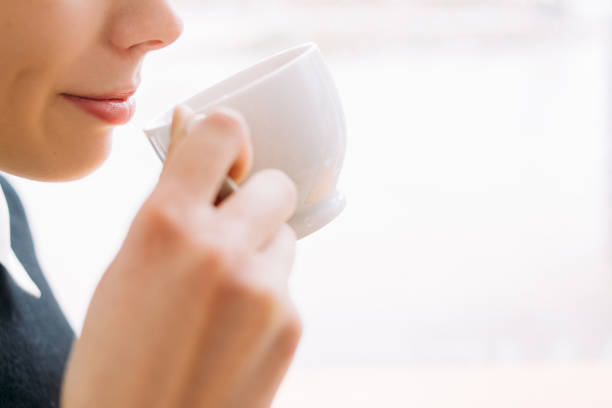istock coffee tea delight woman enjoy cup drink treat 955616062