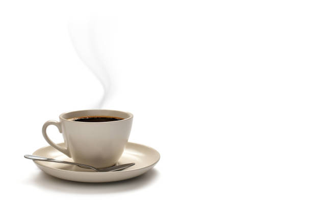 istock Cup of coffee with smoke and coffee beans isolated on white 955616130