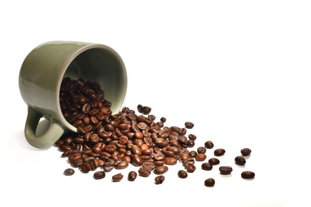 istock Coffee beans in coffee cup isolated on white background 955618710