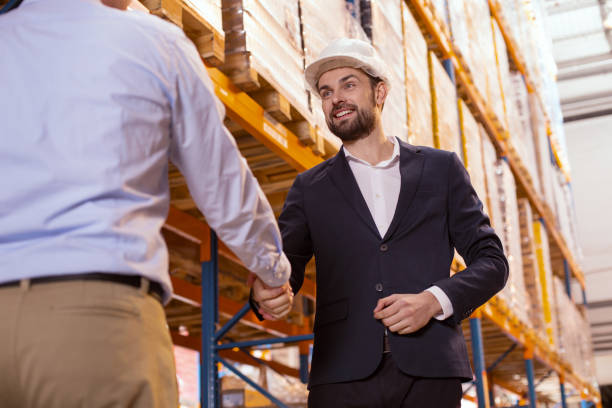 istock Delighted positive businessman greeting his worker 955619160