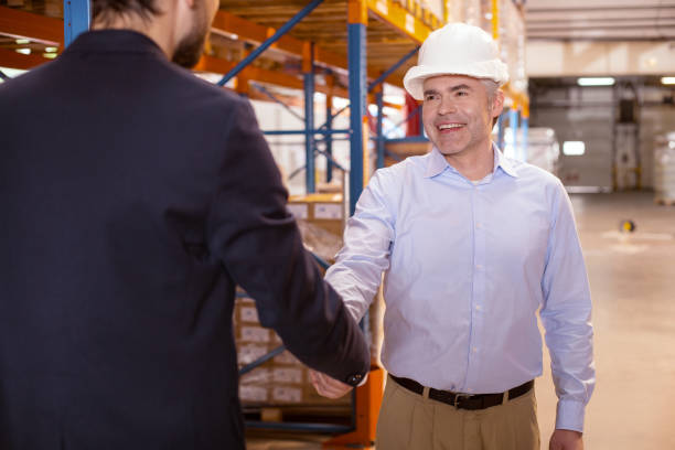 istock Joyful positive man greeting his boss 955619200