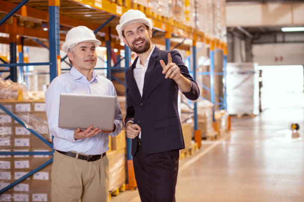 istock Cheerful positive businessman pointing with his finger 955619260