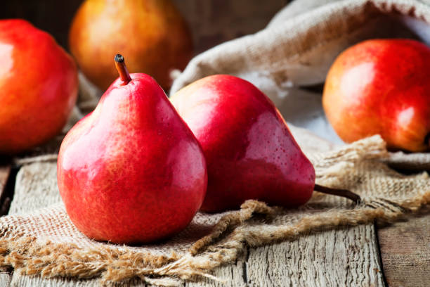 istock Pears, old wooden background 955623544