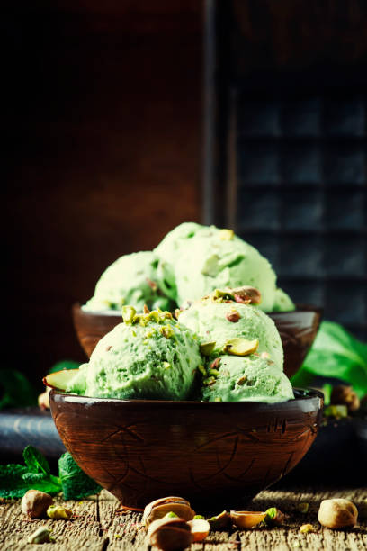 istock Pistachio ice cream with nuts, decorated with mint leaves 955624502
