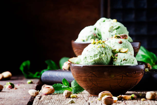 istock Pistachio ice cream with nuts, decorated with mint leaves 955624776