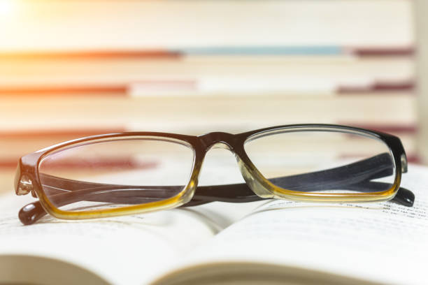istock The glasses are on the open book. 955641268