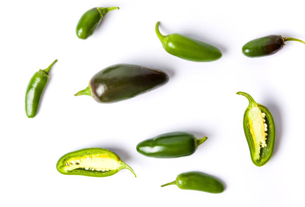 istock Green jalapenos peppers on white background 955645750