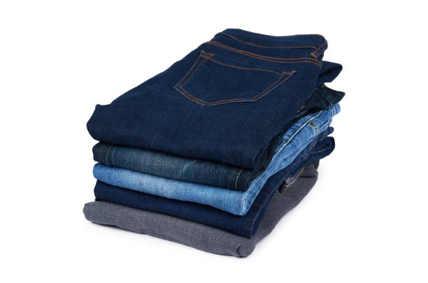 istock Foldet jeans in pile, isolated on white background 955649932