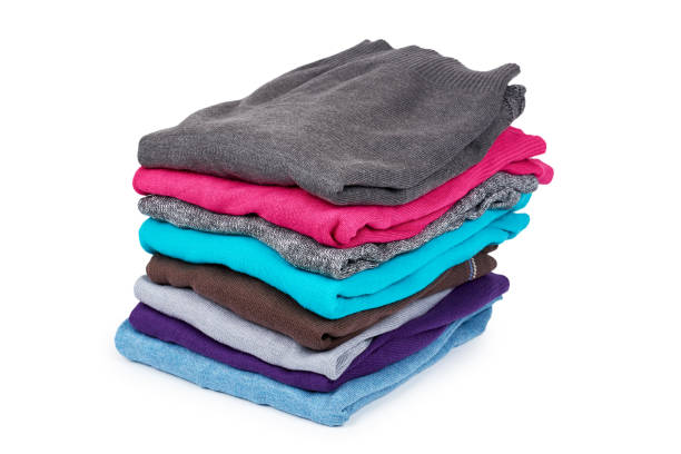 istock pile of multi color fabric texture, wool cloth isolated on white background 955650714