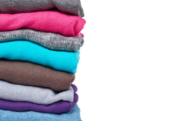istock pile of multi color fabric texture, wool cloth isolated on white background 955650748
