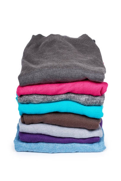 istock pile of multi color fabric texture, wool cloth isolated on white background 955650760