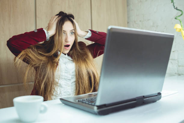 istock Young female designer holding head 955654370