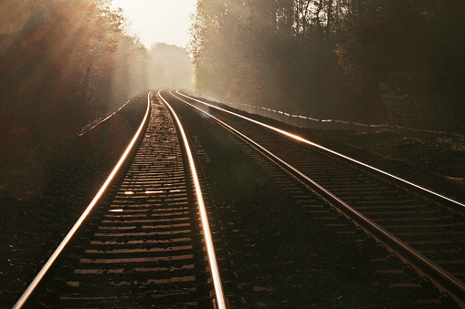 Railway tracks and rising sun