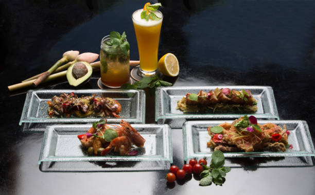 istock Different appetizer and anti pasti. Tapas and bites Sea food platter. Shrimp, octopus, crab on dark background 955657384