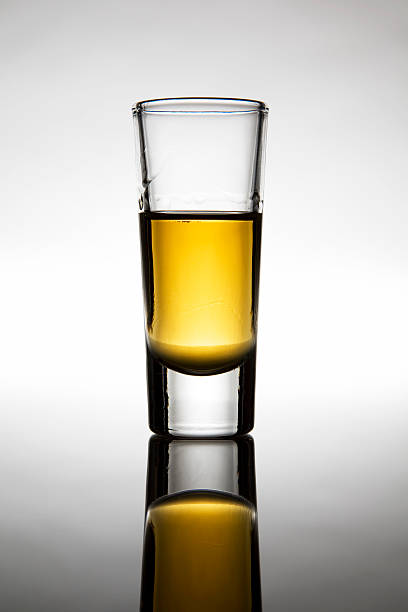 istock Shot glass half full of liquor 95566810