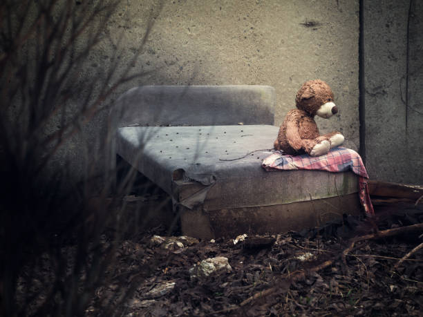 istock A toy bear on an old discarded bed in a dull place 955674788
