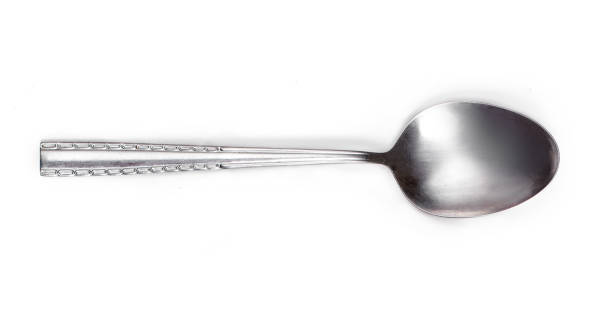 istock Steel tablespoon. Dinning silver spoon isolated on white background. Kitchen utensils concept, close up