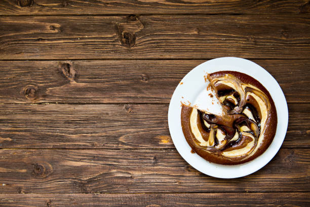 Chocolate cake on wooden background. Top view with copy space