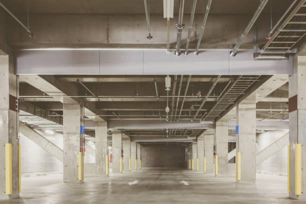istock Parking garage underground interior, neon lights at night 955676670