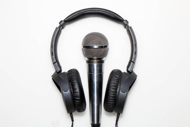 istock Microphone and headphones isolated on white background 955682824
