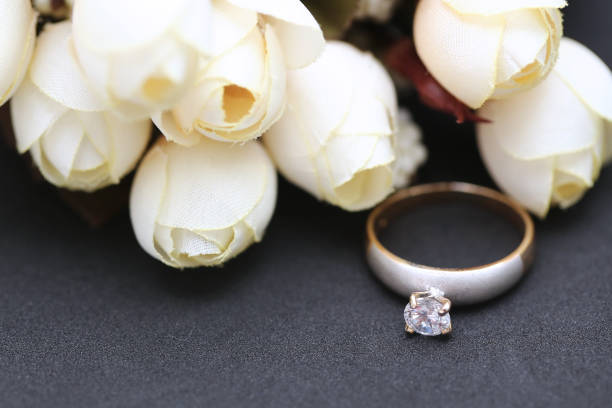 istock Diamond ring and white tulip flower 955685904