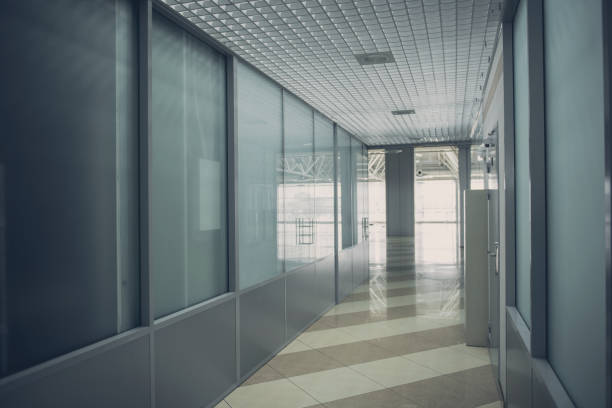 istock Long hallway with glass walls 955690144