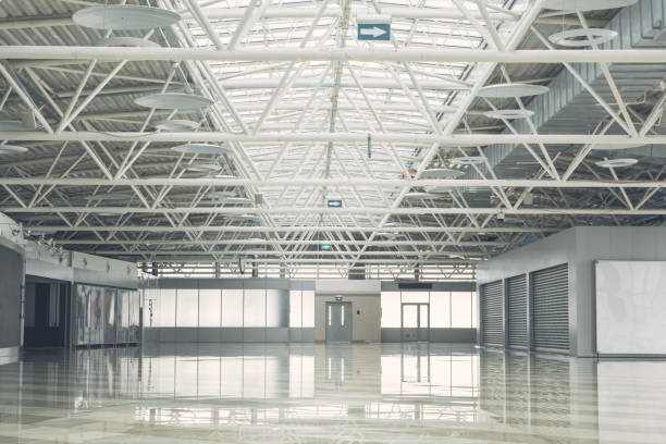istock Huge modern storehouse with concrete floor 955691172