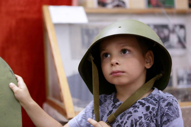 istock Boy in a military helmet 955691202