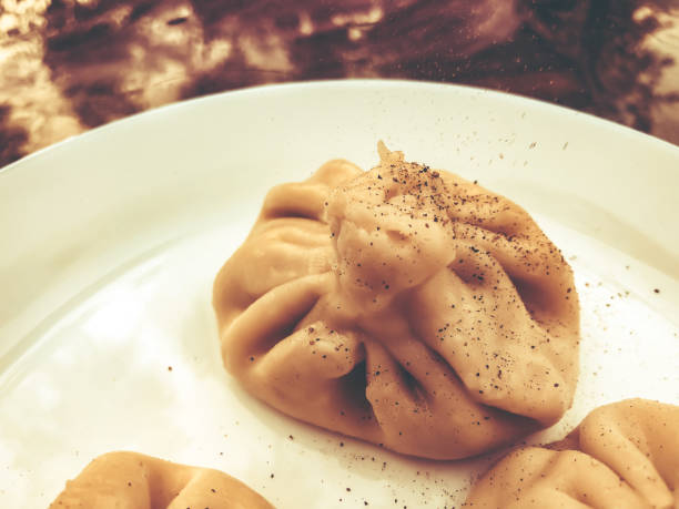 istock Cooked khinkali traditional Georgian dish. 955693778
