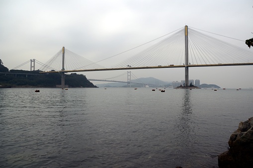 The Ting Kau Bridge, a 1,177-metre long cable-stayed bridge that spans from the northwest of Tsing Yi Island and Tuen Mun Road. In the background, the Tsing Ma Bridge, the world's 9th-longest span suspension bridge. Hong Kong