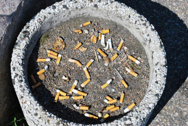 Disposed Cigarette Butts Disposed Cigarette Butts emergency exit photos stock pictures, royalty-free photos & images