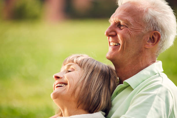 istock Happy Senior Couple Having Picnic In Town 955698998