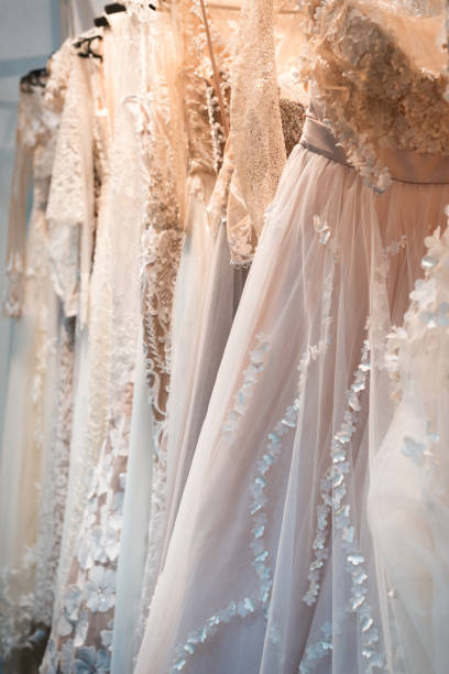 istock Wedding dresses hang on a hanger in a row 955699368